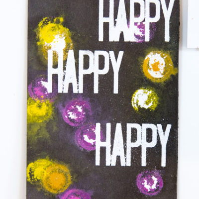 Happy Arty card featuring heat embossing and painted pattern by Taheerah Atchia