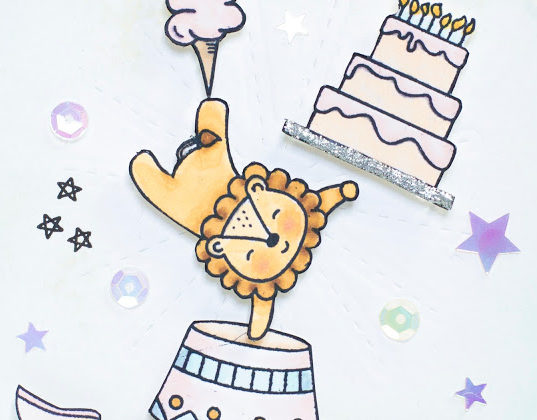Close-up of Big Top Birthday Celebration card by Taheerah Atchia featuring circus lion balancing